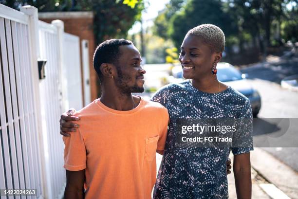 happy siblings outdoors looking at each other - i love you brother stock pictures, royalty-free photos & images