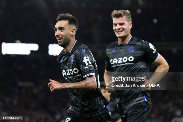 Brais Mendez of Real Sociedad celebrates with teammates after scoring their team's first goal from the penalty spot during the UEFA Europa League...