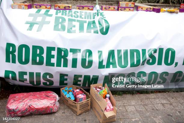 Students display a flag and boxes of cookies during protest at the Australian embassy against the killing of Brazilian student Roberto Laudisio...