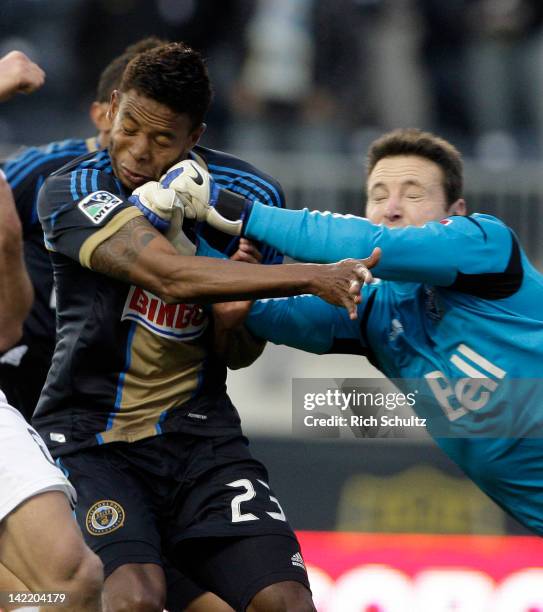 Goalkeeper Joe Cannon of the Vancouver Whitecaps accidentally punches Lionard Pajoy of the Philadelphia Union in the face while he attempts to make a...