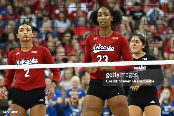 Kaitlyn Hord of Nebraska Cornhuskers lines up with Kenzie Knuckles and Lexi Rodriguez against the Creighton Bluejays at CHI Health Center on...
