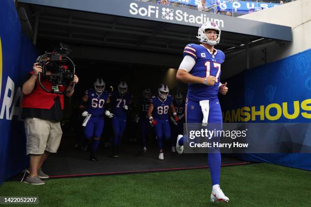 Quarterback Josh Allen of the Buffalo Bills teammates onto the field before the NFL game against the Los Angeles Rams at SoFi Stadium on September...