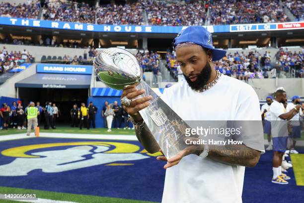 Odell Beckham Jr. Holds the Super Bowl LVI trophy before the NFL game between the Los Angeles Rams and the Buffalo Bills at SoFi Stadium on September...