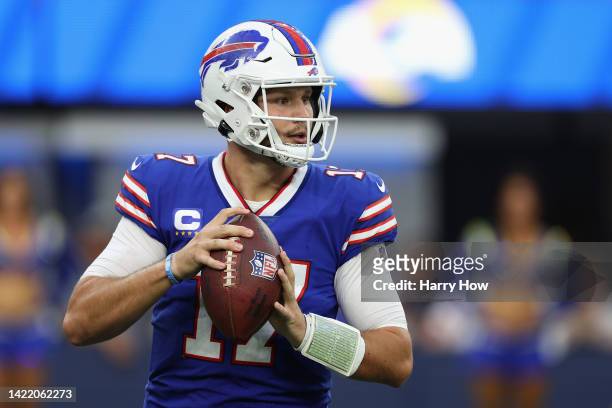 Quarterback Josh Allen of the Buffalo Bills drops back to pass during the first quarter of the NFL game against the Los Angeles Rams at SoFi Stadium...