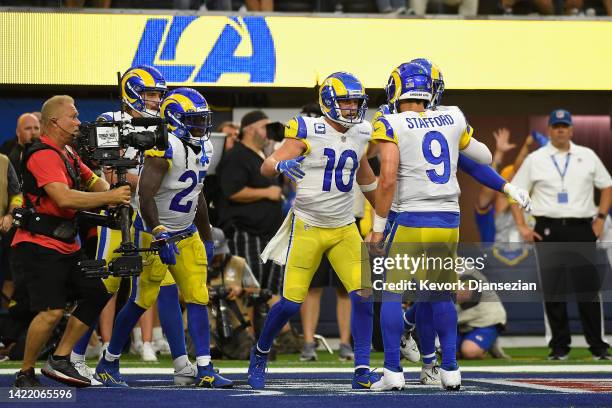 Wide receiver Cooper Kupp of the Los Angeles Rams celebrates with quarterback Matthew Stafford after catching a four-yard touchdown reception against...