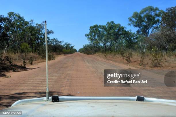 off road vehicle driving on the gibb river road in the kimberley region of western australia - driving car australia road copy space sunlight travel destinations colour image day getting stock pictures, royalty-free photos & images