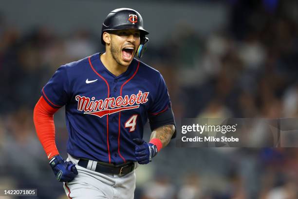 Carlos Correa of the Minnesota Twins reacts after hitting a 2-run home run to left field in the eighth inning against the New York Yankees at Yankee...