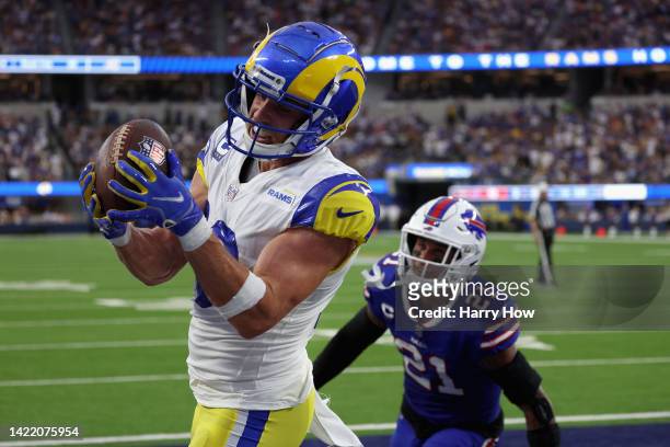 Wide receiver Cooper Kupp of the Los Angeles Rams catches a four-yard touchdown reception ahead of safety Jordan Poyer of the Buffalo Bills during...