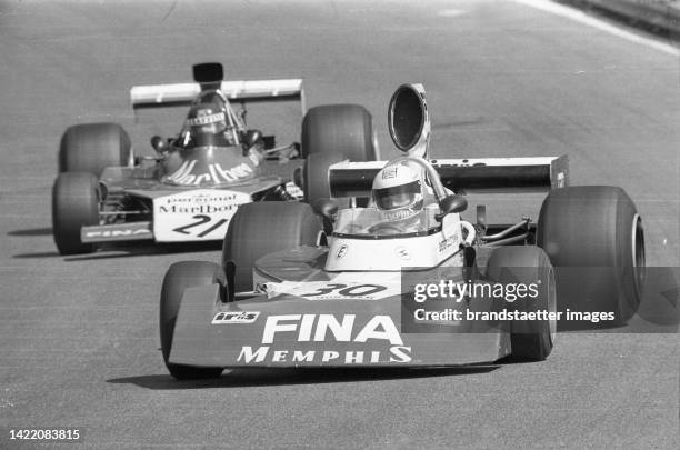 The Austrian racing driver Dieter Quester with Sutrees in his own Formula 1 race. Behind him Jacques Laffite. Grand Prix of Austria. Austria ring....