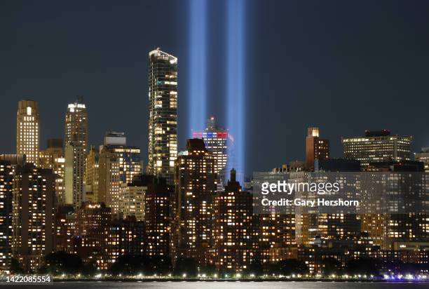 The Tribute in Light is illuminated above lower Manhattan ahead of the 21st anniversary of 9/11 in New York City on September 8 as seen from Jersey...