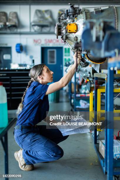 real life young female aircraft engineer apprentice at work - aviation worker stock pictures, royalty-free photos & images