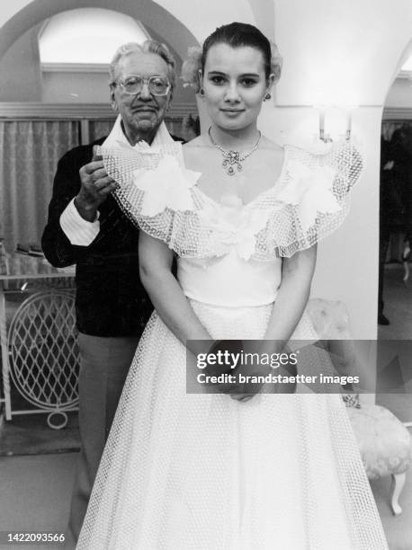 Jenny Jürgens trying on her opera ball dress in Fred Adlmüller's fashion store . Vienna. 12 February 1985.