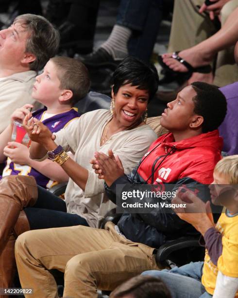 Regina King and her son Ian Alexander Jr. Attend a basketball game between the New Orleans Hornets and the Los Angeles Lakers at Staples Center on...