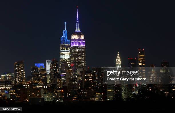 The Empire State Building in New York City is lit in purple to honor the life of Queen Elizabeth II who passed away earlier in the day on September 8...