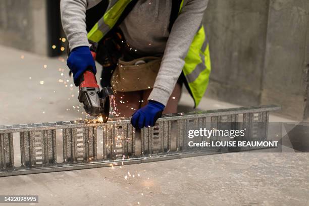 real life female electrician at work - tradie stock pictures, royalty-free photos & images