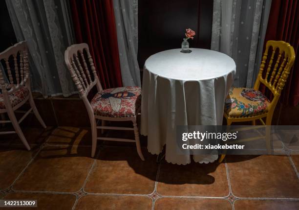 table and chairs by the window - upholstered furniture stock pictures, royalty-free photos & images