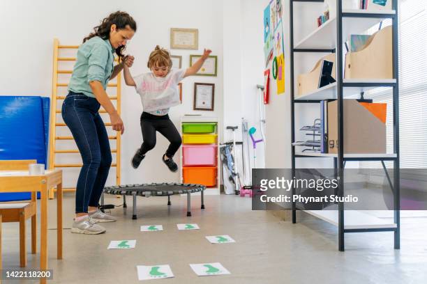 down syndrome: occupational therapy - doctor leaping stock pictures, royalty-free photos & images