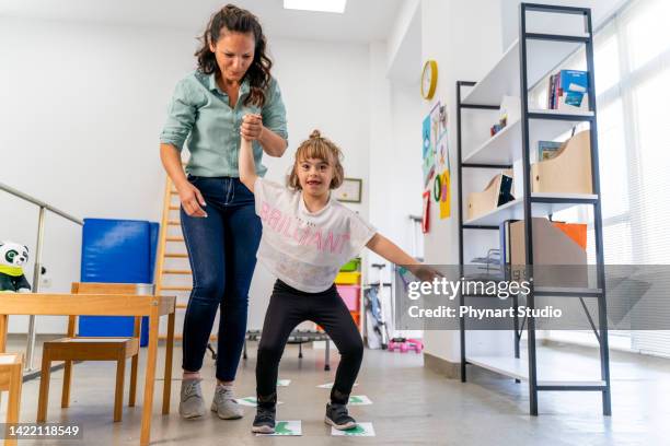 down syndrome: occupational therapy - mental disability stock pictures, royalty-free photos & images