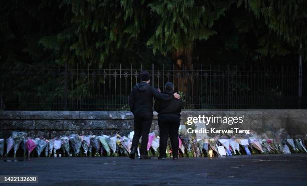 Mourners lay flowers outside Balmoral Castle on September 09, 2022 in Aberdeen, Scotland. Elizabeth Alexandra Mary Windsor was born in Bruton Street,...