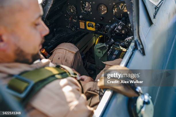 pilot in the cockpit of supermarine spitfire - british military stock pictures, royalty-free photos & images