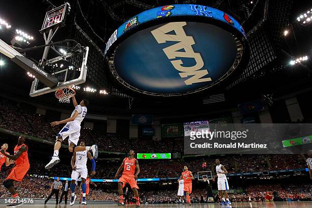 Anthony Davis of the Kentucky Wildcats dunks the ball late in the second half against the Louisville Cardinals during the National Semifinal game of...