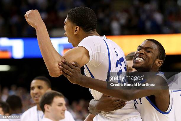 Michael Kidd-Gilchrist celebrates along with teammate Anthony Davis of the Kentucky Wildcats in the second half against the Louisville Cardinals...