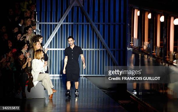 Fashion designer Marc Jacobs acknowledges the public during the Louis Vuitton Fall/Winter 2012-2013 ready-to-wear collection show, on March 7, 2012...