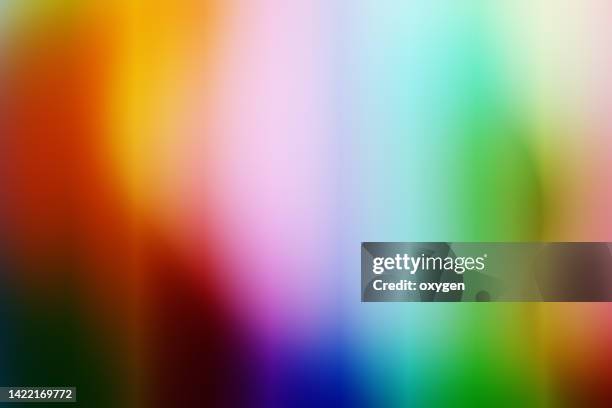 abstract colorful vibrant neon multi-colored vertical blured parallel striped background - spettro luminoso foto e immagini stock