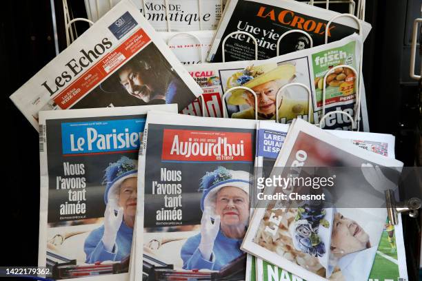 The front pages of the French newspapers, Le Figaro, Les Echos, Le Parisien, Les Echos and Aujourd'hui en France are displayed in a newsstand with...