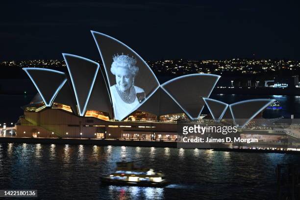 An image of HM The Queen Elizabeth II is projected onto the sails of the Sydney Opera House at on September 09, 2022 in Sydney, Australia. Queen...