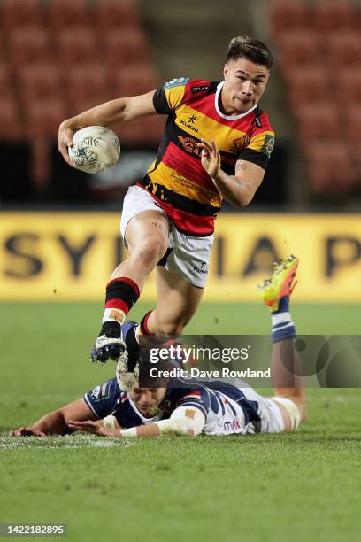 Tepaea Cook-Savage of Waikato avoids a tackle by Adrian Choat of Auckland during the round six Bunnings NPC match between Waikato and Auckland at FMG...