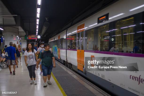 Passengers next to a train on one of the platforms of Sants station, on September 9 in Barcelona, Catalonia, Spain. Adif technicians have solved the...