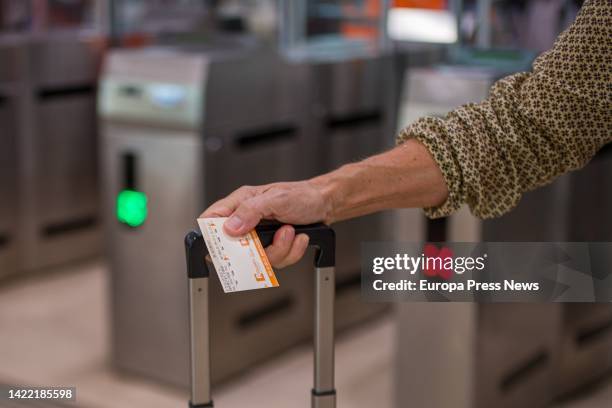 Traveler holds a ticket after crossing the turnstiles at Sants station, on September 9 in Barcelona, Catalonia, Spain. Adif technicians have solved...