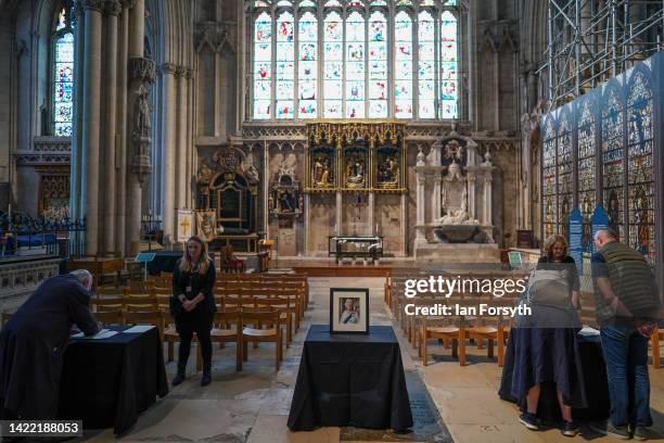 Members of the public sign a book of condolence in York Minster after it was announced that Queen Elizabeth II has passed away on September 09, 2022...