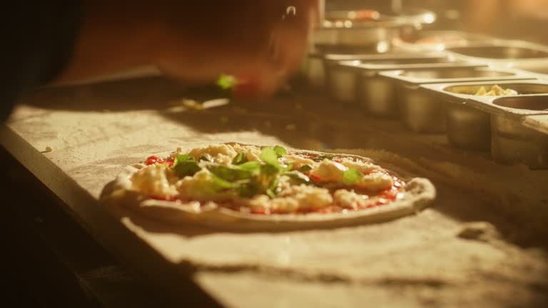 https://media.gettyimages.com/id/1422189406/video/in-restaurant-professional-chef-preparing-pizza-kneading-dough-adding-ingredients-special.jpg?b=1&s=640x640&k=20&c=eV830H8TOnWluzjSwPTD3C5ottGiZX0Ms7EBEu7VqP8=