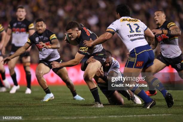 Nathan Cleary of the Panthers is tackled during the NRL Qualifying Final match between the Penrith Panthers and the Parramatta Eels at BlueBet...