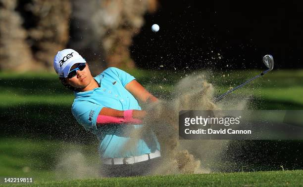 Yani Tseng of Taiwan plays her third shot at the par 4, 15th hole during the third round of the 2012 Kraft Nabisco Championship at Mission Hills...