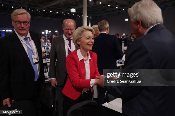 European Commission President Ursula von der Leyen greets leading CDU member Volker Bouffier on the first of a two-day federal party congress of the...