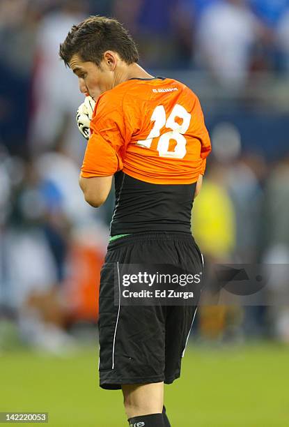 Yimy Cuellar of El Salvador wipes his face after giving up a goal during a game against Honduras in the 2012 CONCACAF Men's Olympic Qualifying...