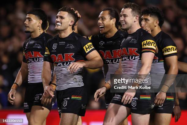 Dylan Edwards of the Panthers celebrates with Jarome Luai of the Panthers and Nathan Cleary of the Panthers after scoring a try during the NRL...