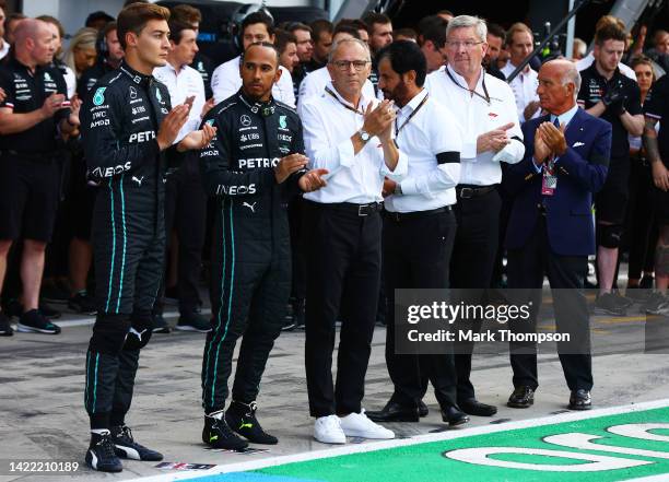 George Russell of Great Britain and Mercedes, Lewis Hamilton of Great Britain and Mercedes, Stefano Domenicali, CEO of the Formula One Group,...