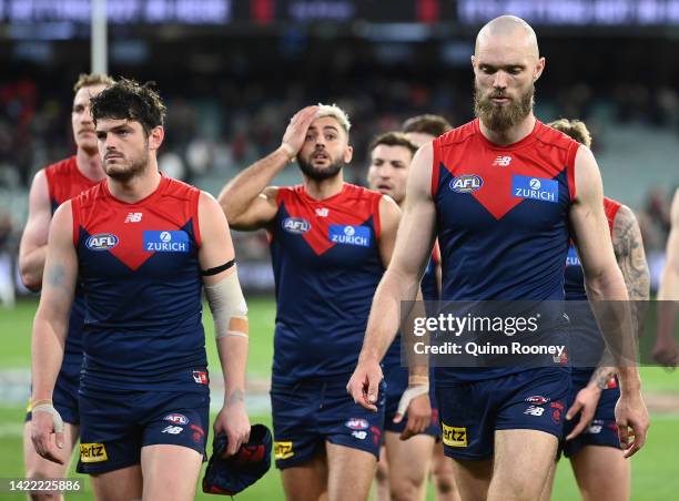 Angus Brayshaw, Christian Salem and Max Gawn of the Demons look dejected after losing the AFL Second Semifinal match between the Melbourne Demons and...