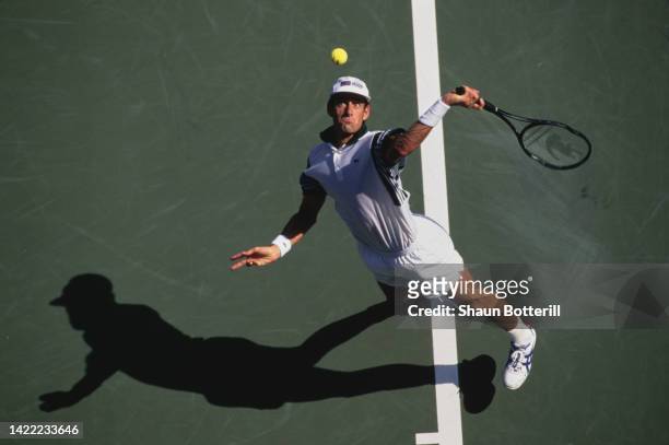Guy Forget from France keeps his eyes on the tennis ball as he serves against Félix Mantilla of Spain during their Men's Singles Second Round match...