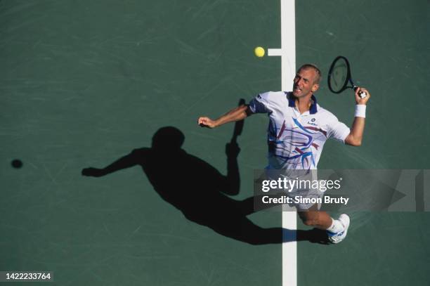 Thomas Muster from Austria keeps his eyes on the tennis ball as he serves against Mark Woodforde of Australia during their Men's Singles Second Round...