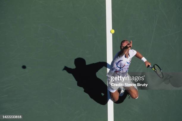 Thomas Muster from Austria keeps his eyes on the tennis ball as he serves against Mark Woodforde of Australia during their Men's Singles Second Round...