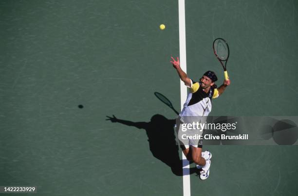 Goran Ivanisevic from Croatia keeps his eyes on the tennis ball as he serves against Cristiano Caratti of Italy during their Men's Singles Second...