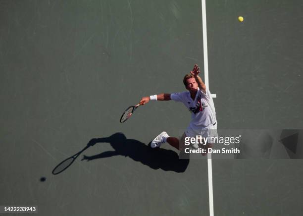 Stefan Edberg from Sweden keeps his eyes on the tennis ball as he serves against Jeff Tarango of the United States during their Men's Singles Second...