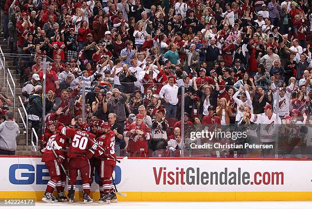 Oliver Ekman-Larsson of the Phoenix Coyotes celebrates with teammates after scoring a first period goal against the Anaheim Ducks during the NHL game...