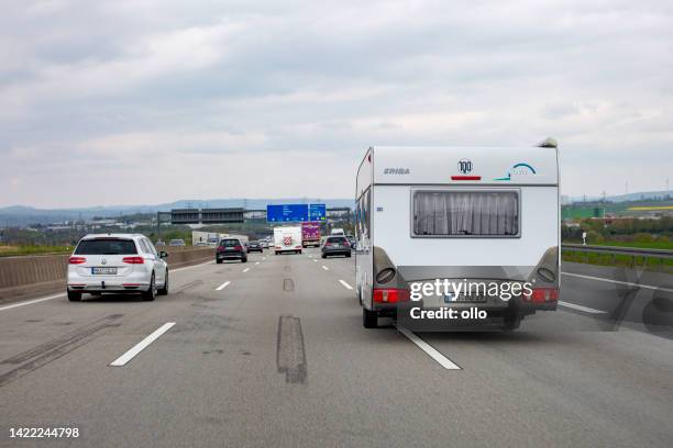 camper trailer on german highway a3 - autobahn stock pictures, royalty-free photos & images