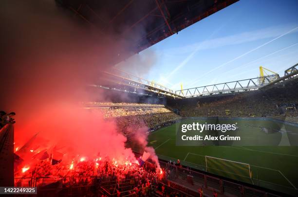 Fans show their support with flares prior to the UEFA Champions League group G match between Borussia Dortmund and FC Copenhagen at Signal Iduna Park...